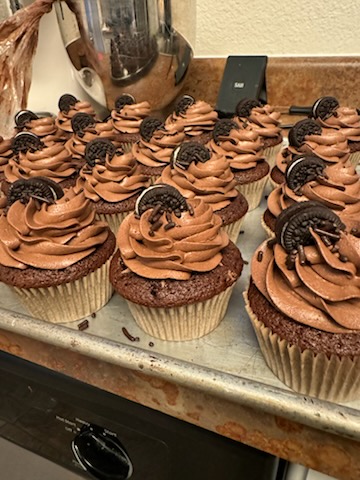 Chocolate cupcakes topped with mini Oreos