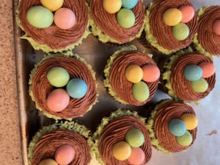 Chocolate nest cupcakes with pastel candy eggs
